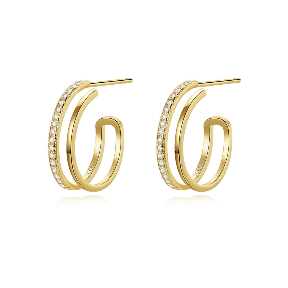 Gold hoop earrings with zirconian on a white background.