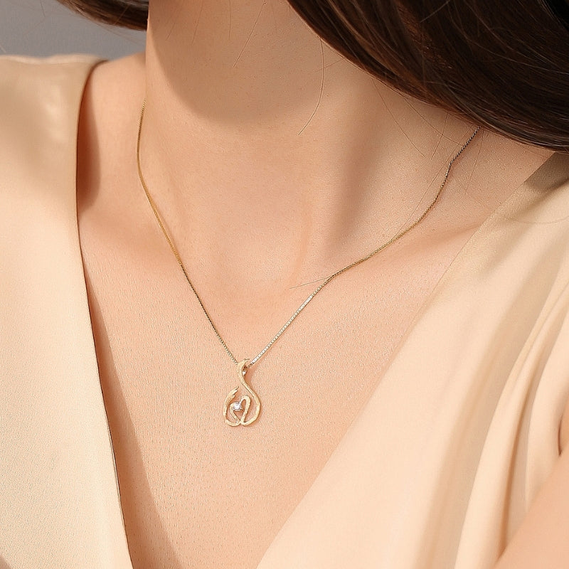 DANCING SWAN diamond pendant, 18k white gold