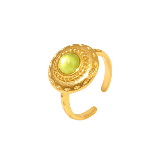 Gold ring with a green stone from SKADIS Jewelry