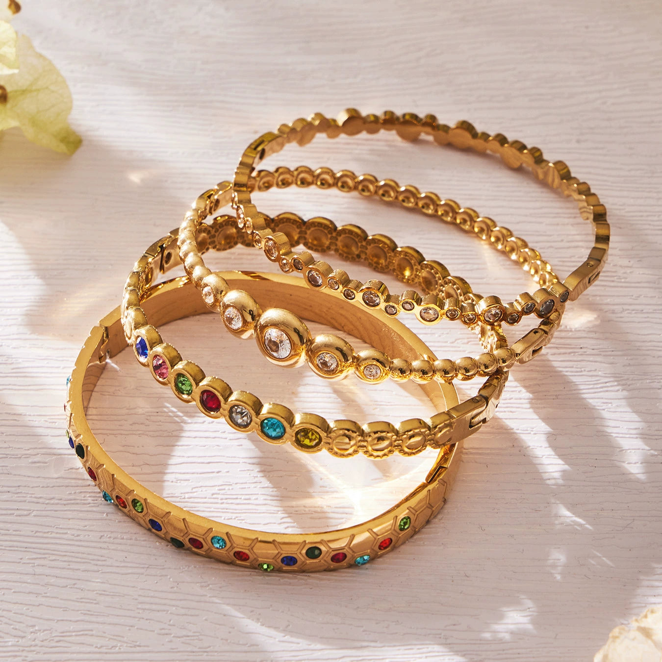 Set of gold-plated bangles with colorful stones from SKADIS Jewelry