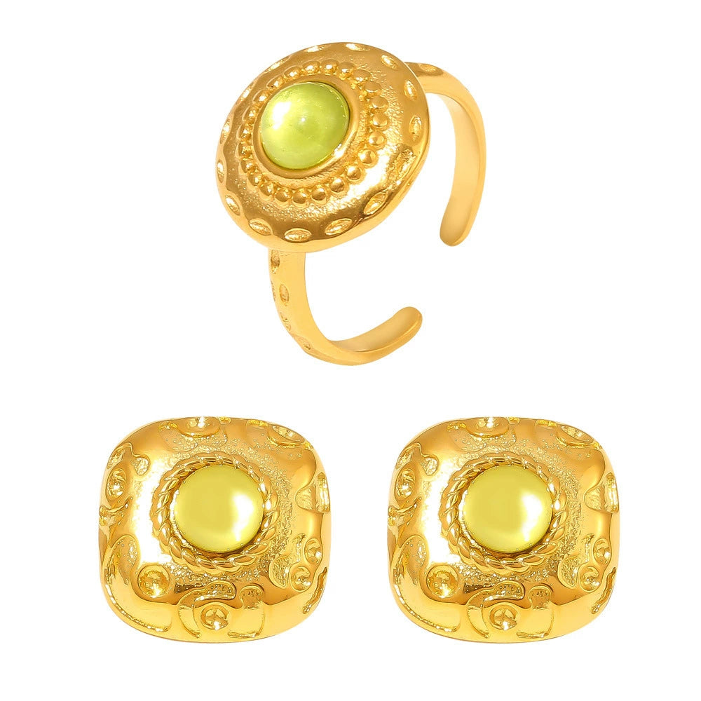 Gold ring and earrings with green stones from SKADIS Jewelry