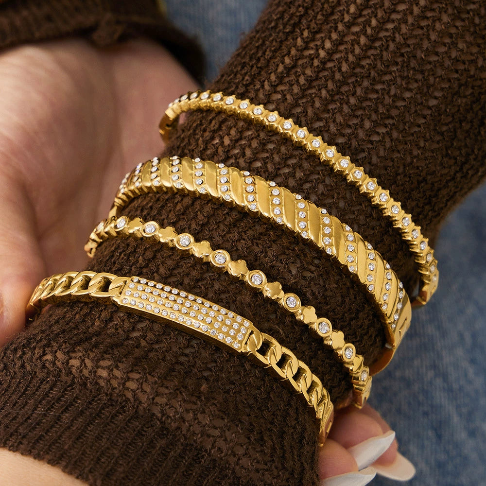 Gold bangles from SKADIS Jewelry