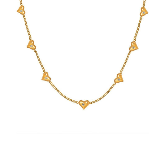 Gold necklace with heart-shaped pendants from SKADIS Jewelry