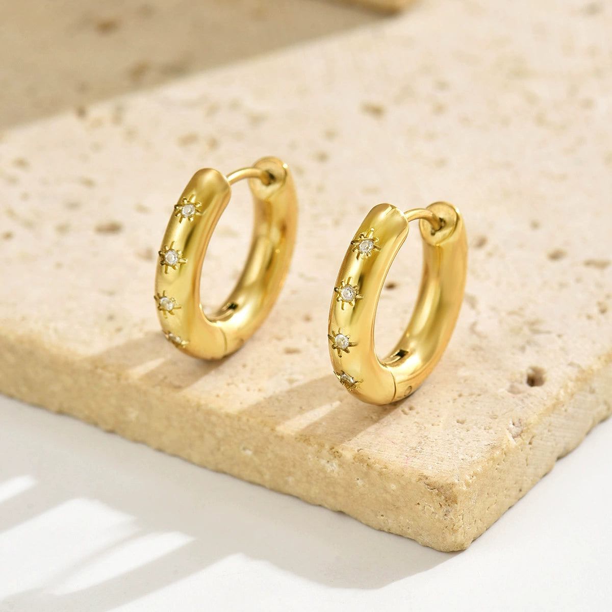 Gold hoop earrings with zirconia from SKADIS Jewelry