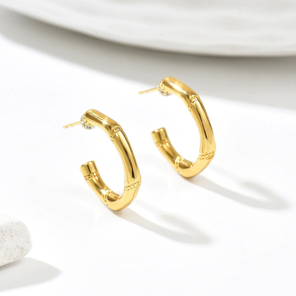 Gold hoop earrings from SKADIS Jewelry