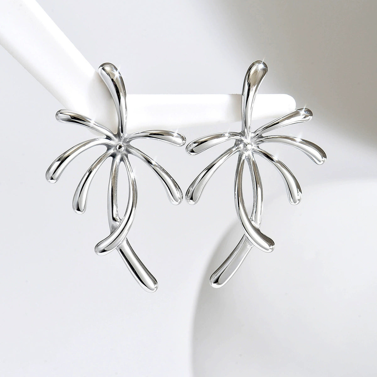 Earrings with a palm tree design from SKADIS Jewelry