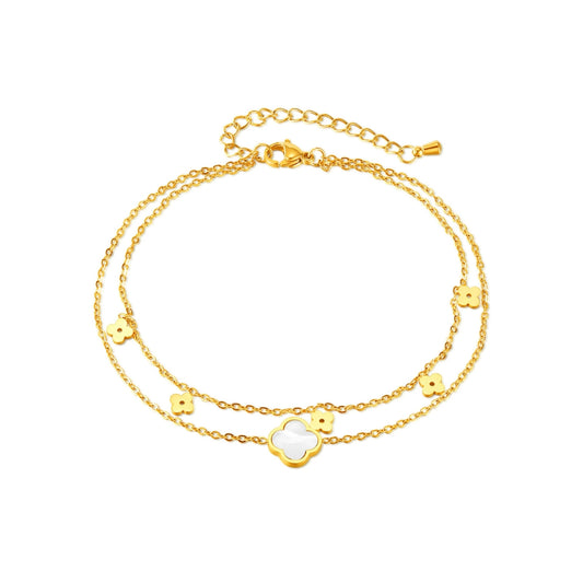 Gold bracelet with floral and heart-shaped charms from skadis jewelry
