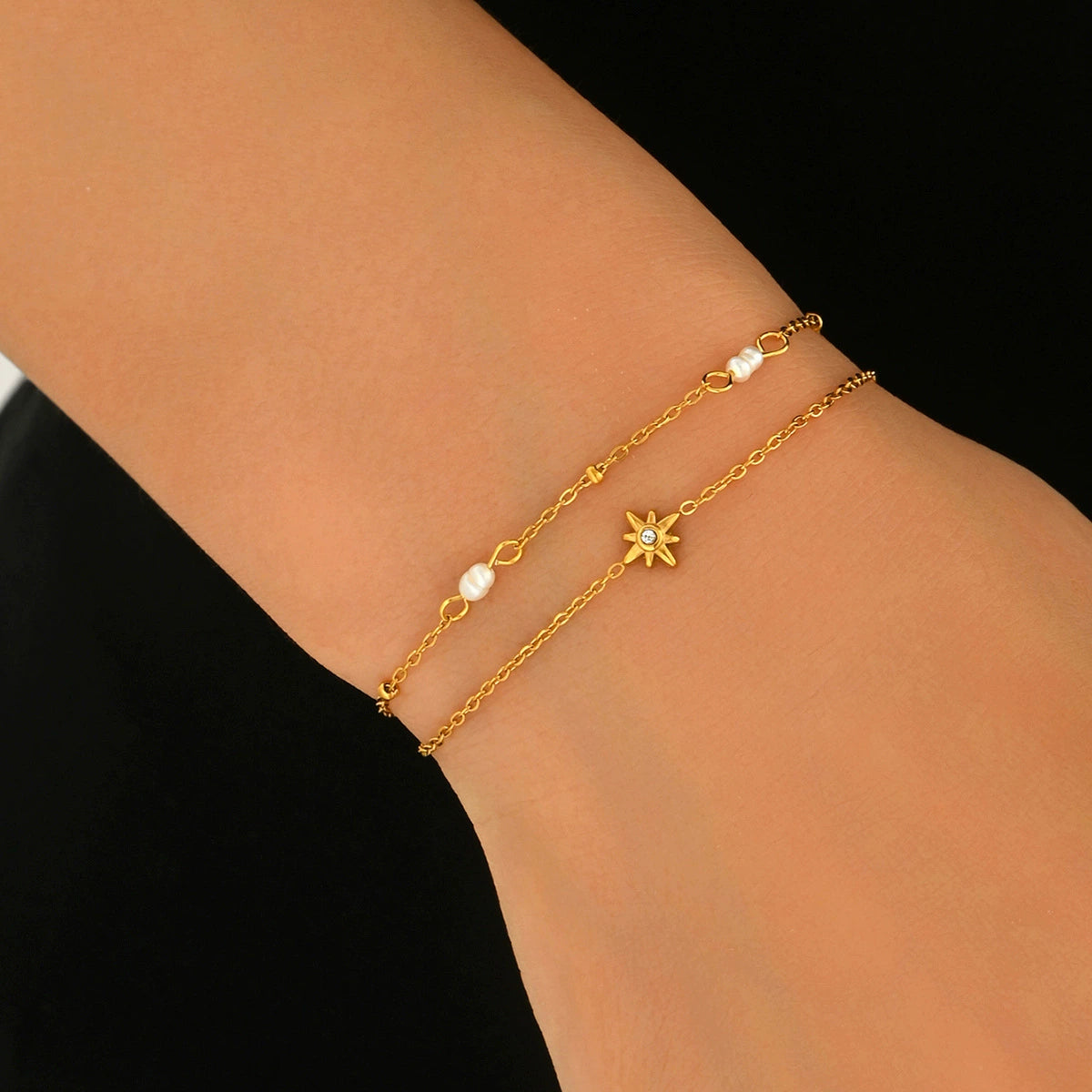Gold bracelet with star and pearl charm from skadis jewelry