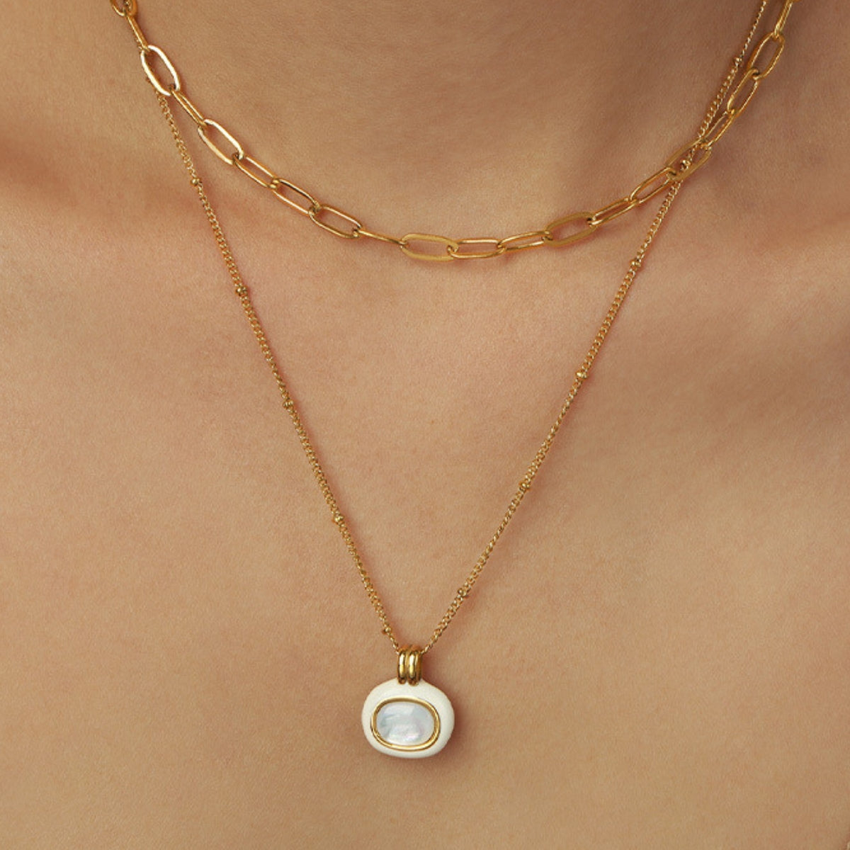Gold necklace with a pendant from SKADIS Jwelry
