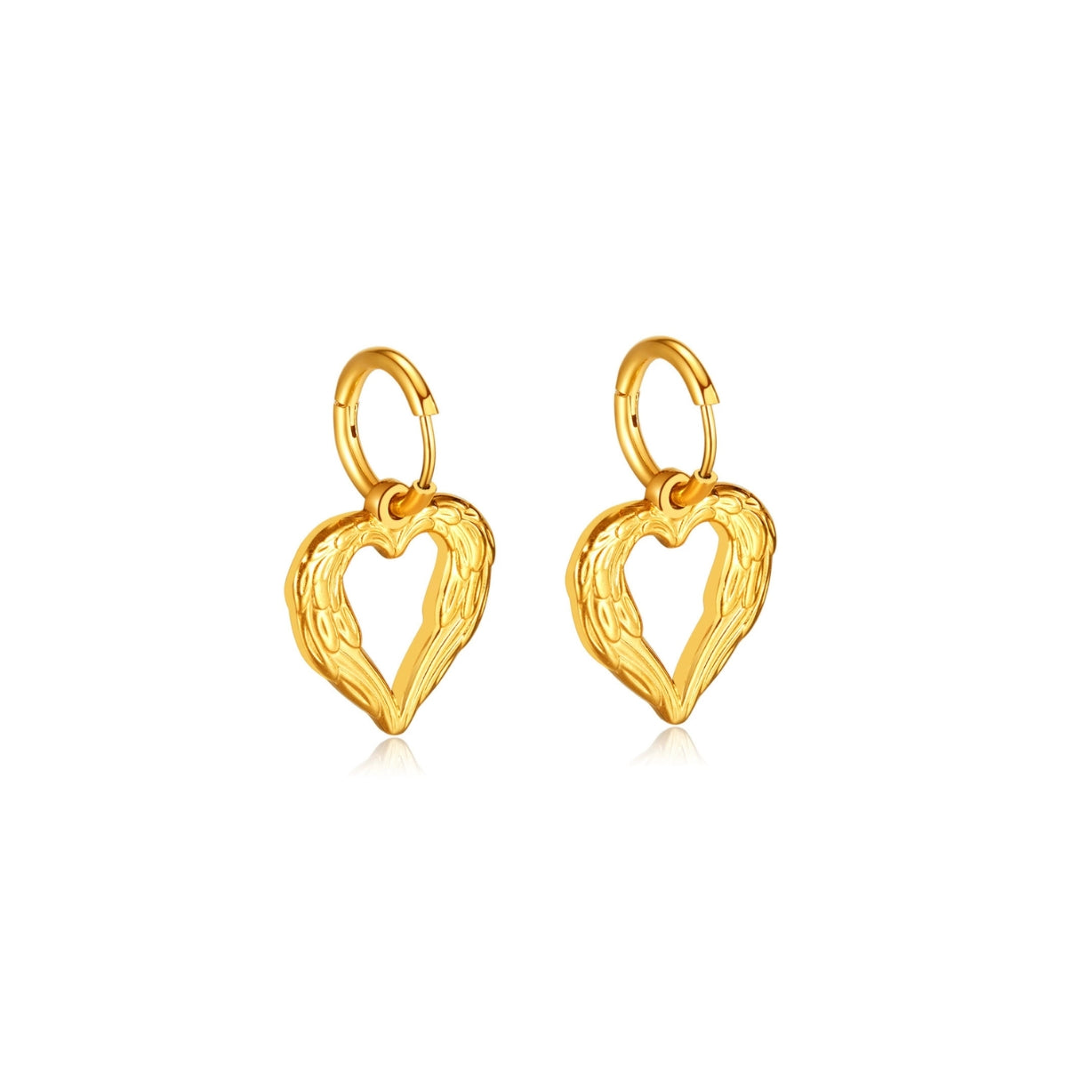 Gold heart-shaped earrings from SKADIS Jewelry on a white background