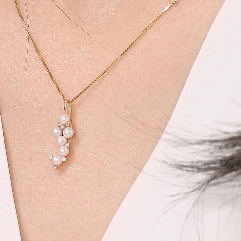 SKADIS FREYA pearl diamond pendant on model, 18k gold