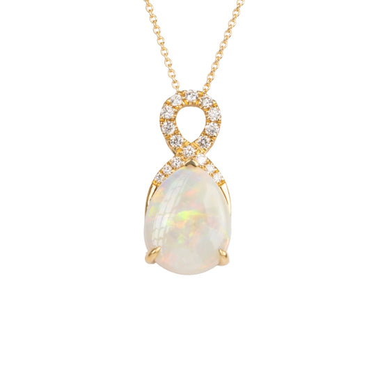 Opal pendant necklace with gold and diamond accents on a white background