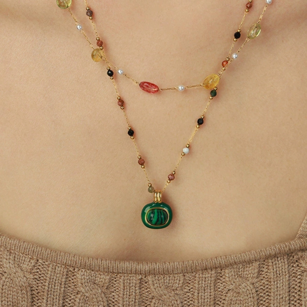 Necklace with multi colored beads and a green pendant from SKADIS Jewelry