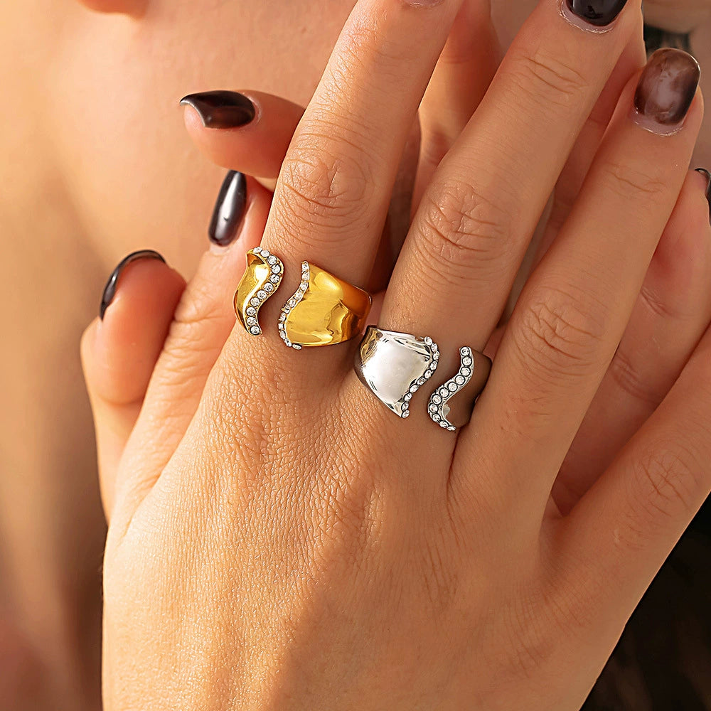 Close-up of a hand wearing two rings from SKADIS Jewelry