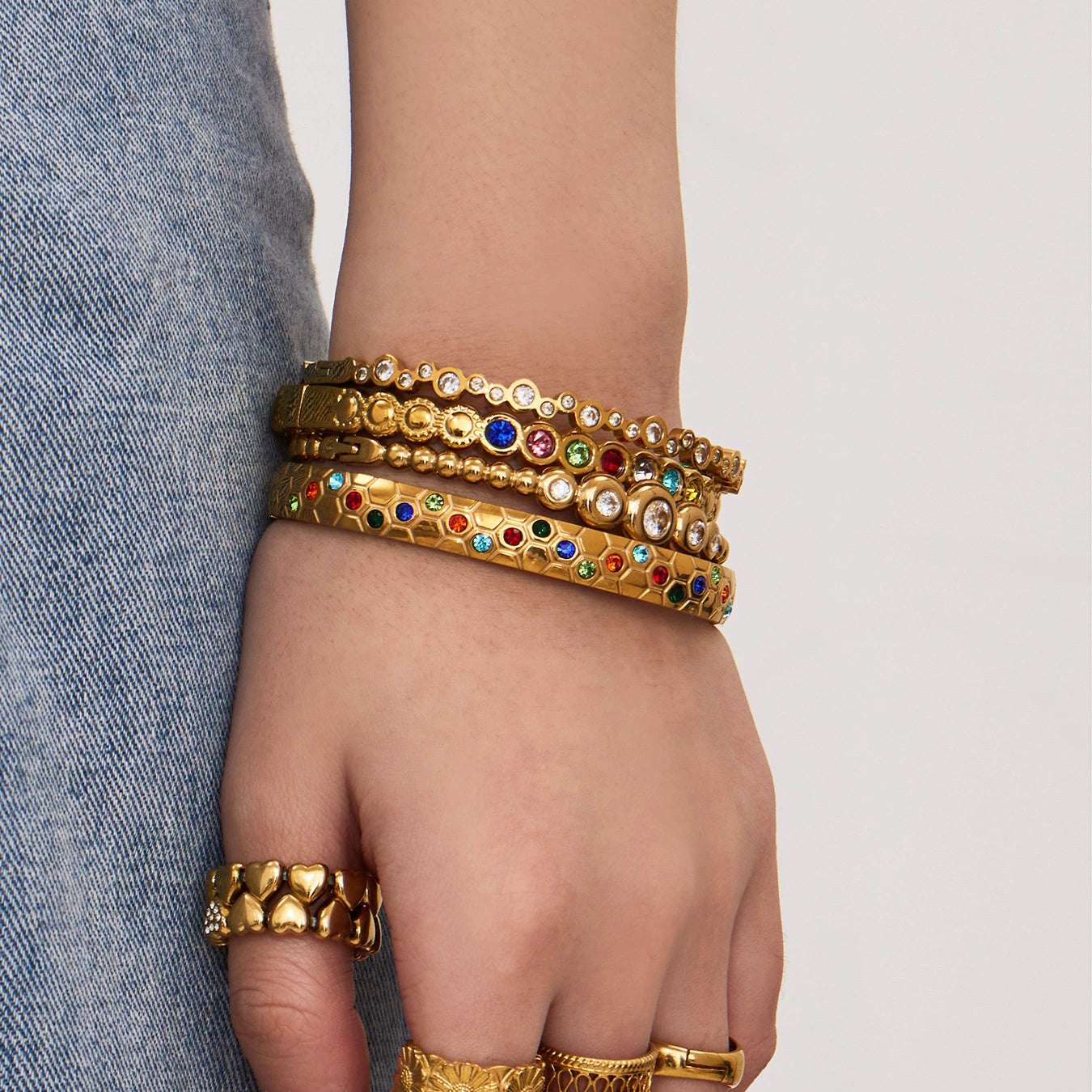 Gold-plated bangles with colorful stones from SKADIS Jewelry