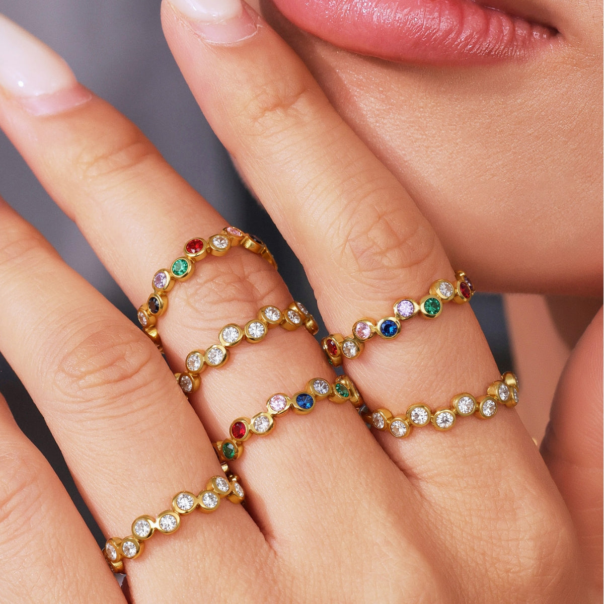 Close-up of a hand wearing  gold rings from SKADIS Jewelry