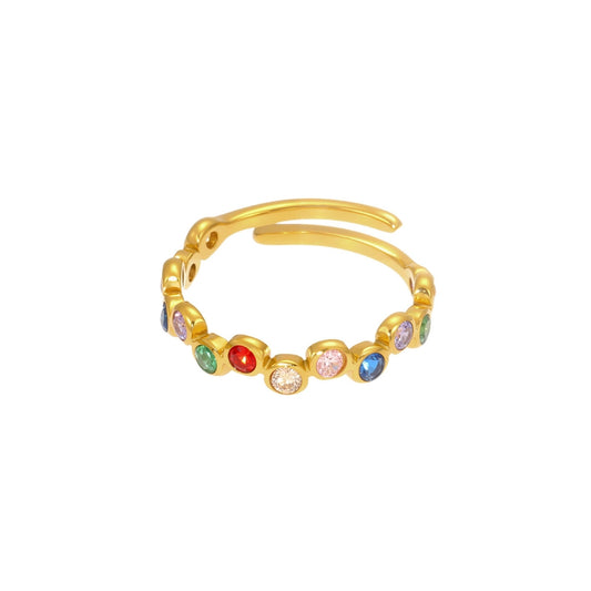 Gold ring with colorful zirconia on a white background