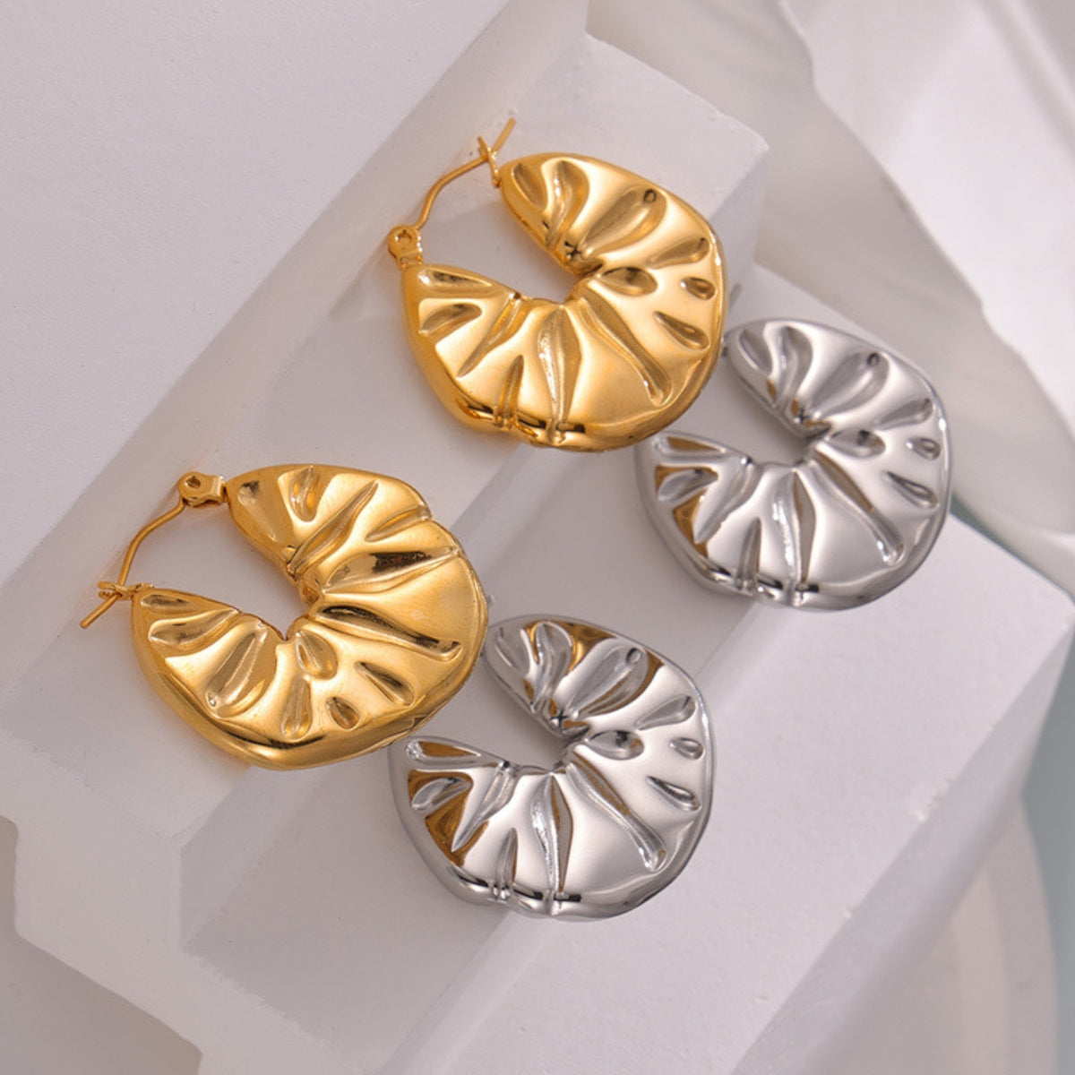 Gold and silver hoop earrings from SKADIS Jewelry