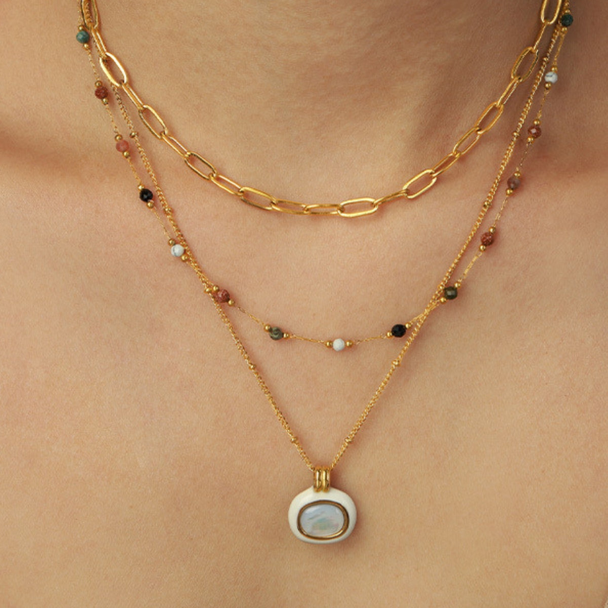 Gold necklace with a pendant from SKADIS Jewelry