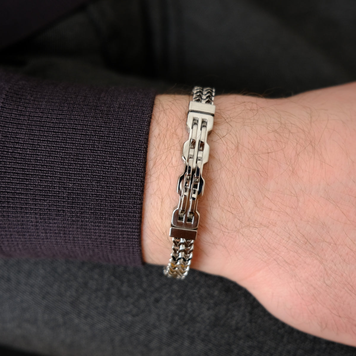 Steel bracelet on a person's wrist from SKADIS Jewelry