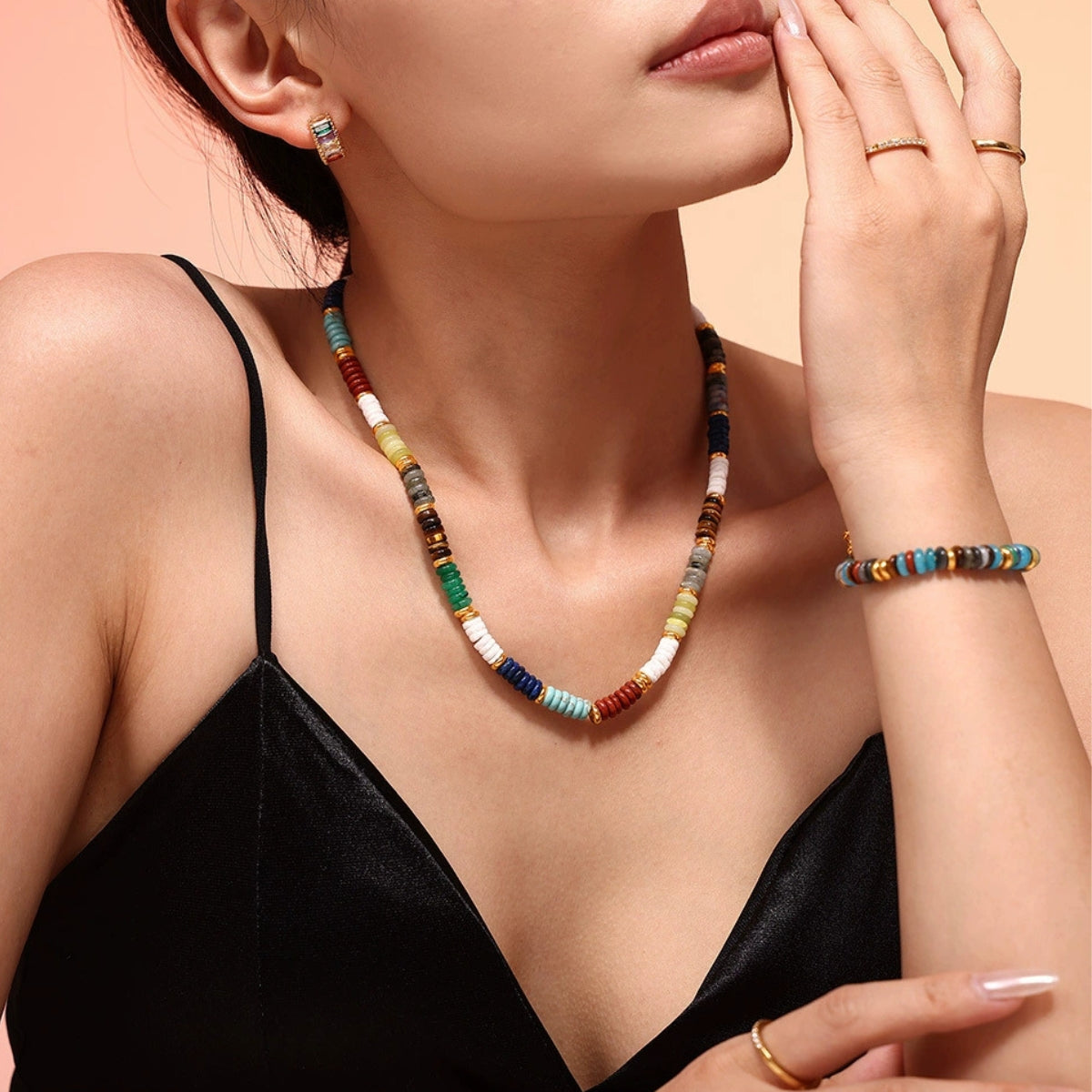 Woman wearing a colorful beaded necklace and bracelet - SKADIS Jewelry