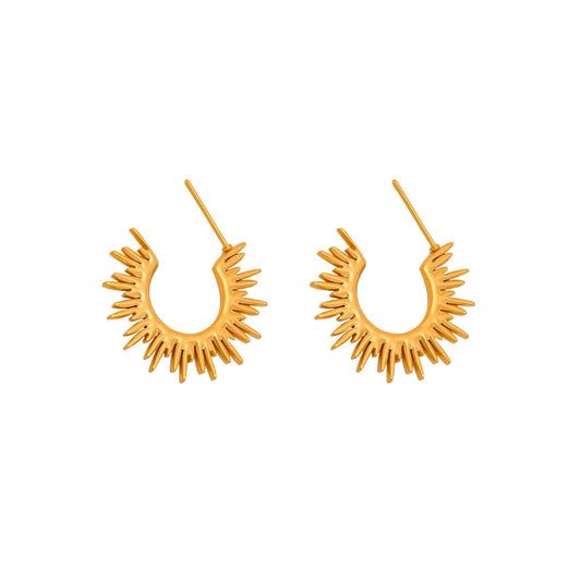 Pair of gold hoop earrings with sunburst design from SKADIS Jewelry