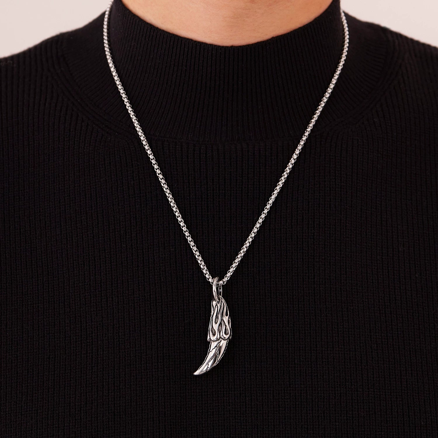 Man wears a steel necklace from SKADIS Jewelry