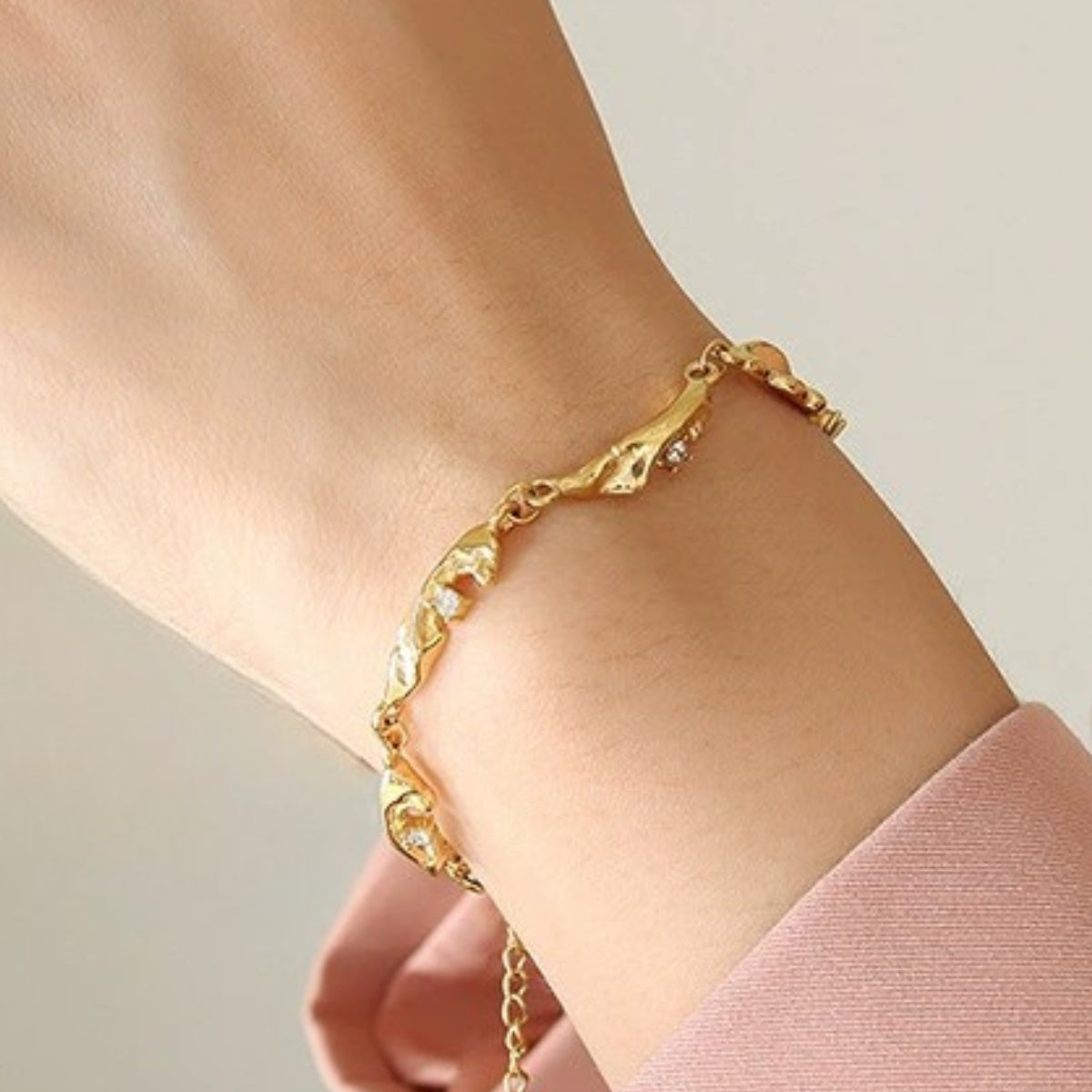 Gold-plated bracelet on a wrist from SKADIS Jewelry