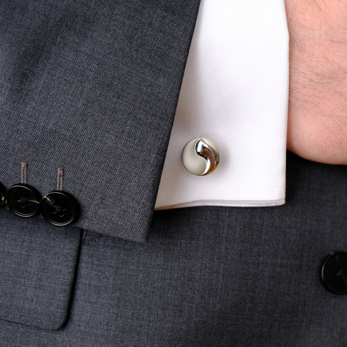 Close-up cufflinks with a white shirt from SKADIS jewelry