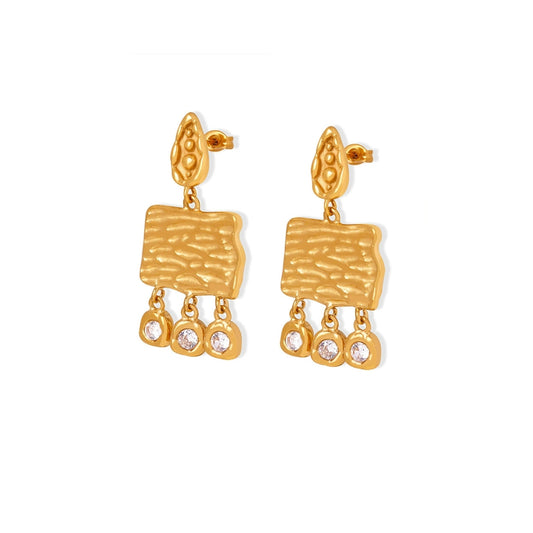 Gold earrings with textured design from SKADIS Jewelry