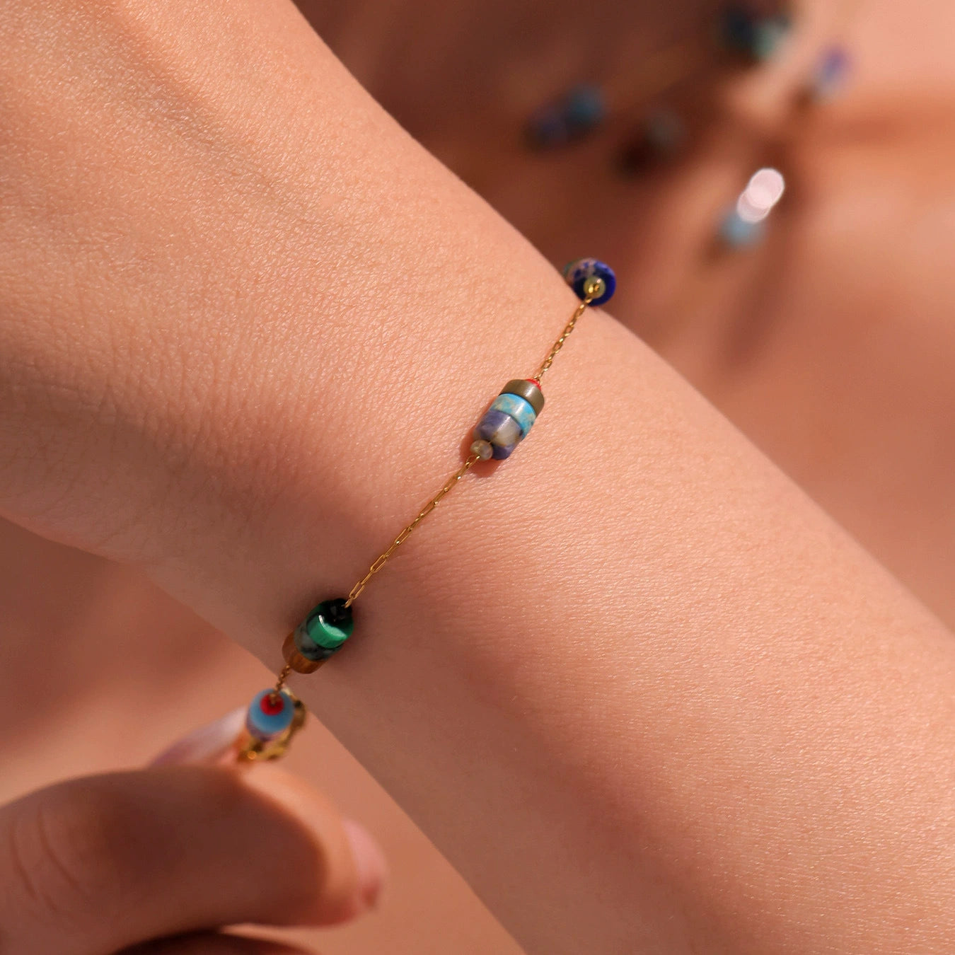 Close-up of a wrist wearing a beaded bracelet from skadis jewelry