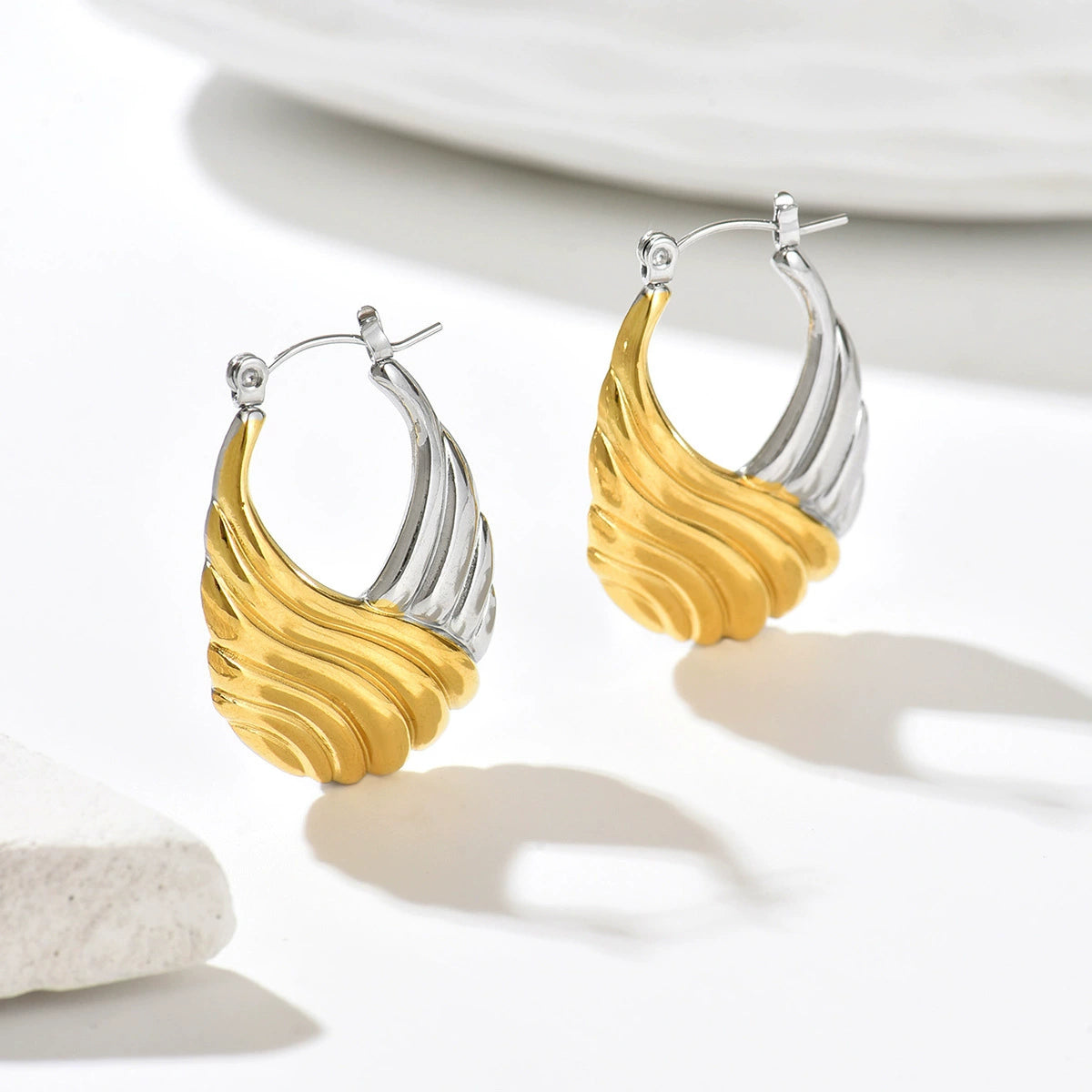 Pair of gold and silver plated hoop earrings from SKADIS Jewelry
