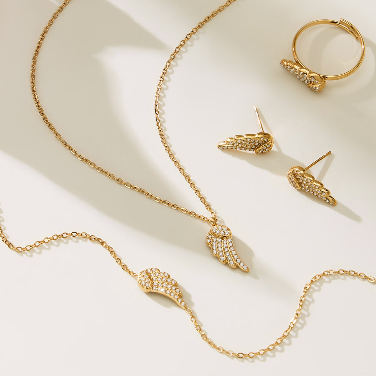 Gold-plated angel wings design jewelry set from SKADIS Jewelry